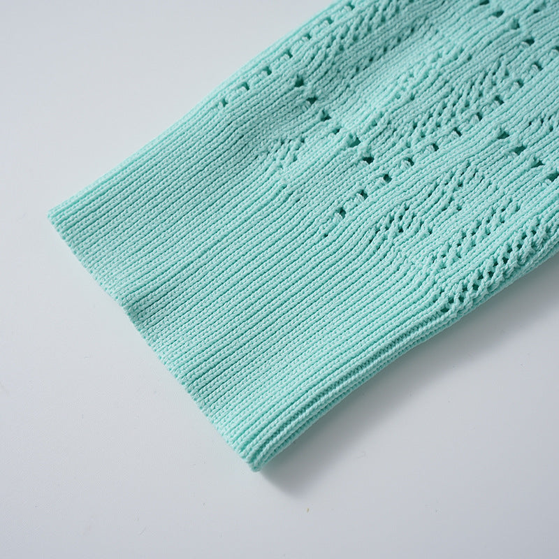 A small chanel-style jade button letter hollowed-out knitted cardigan