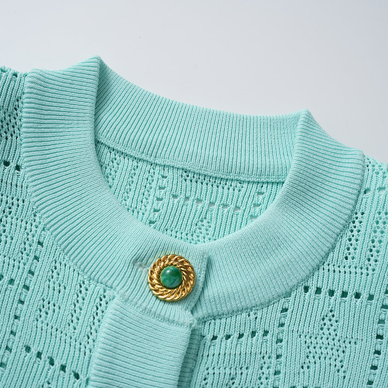 A small chanel-style jade button letter hollowed-out knitted cardigan