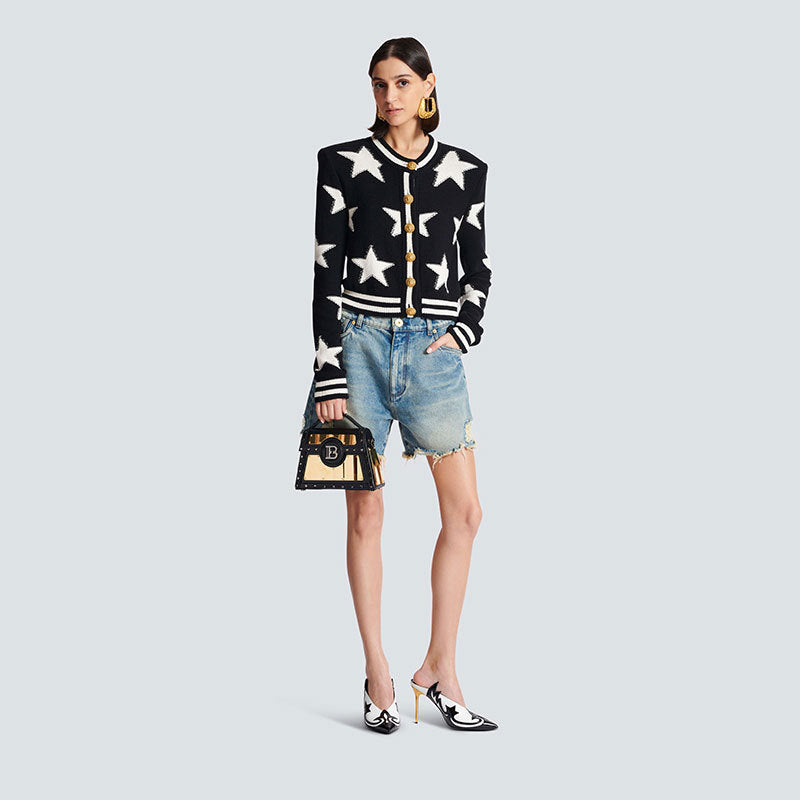 A chanel-style shoulder-padded knitted cardigan