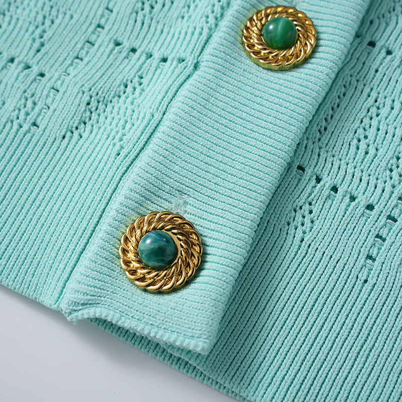 A small chanel-style jade button letter hollowed-out knitted cardigan