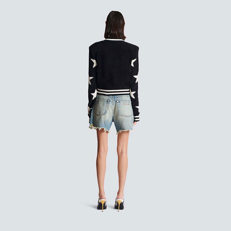 A chanel-style shoulder-padded knitted cardigan
