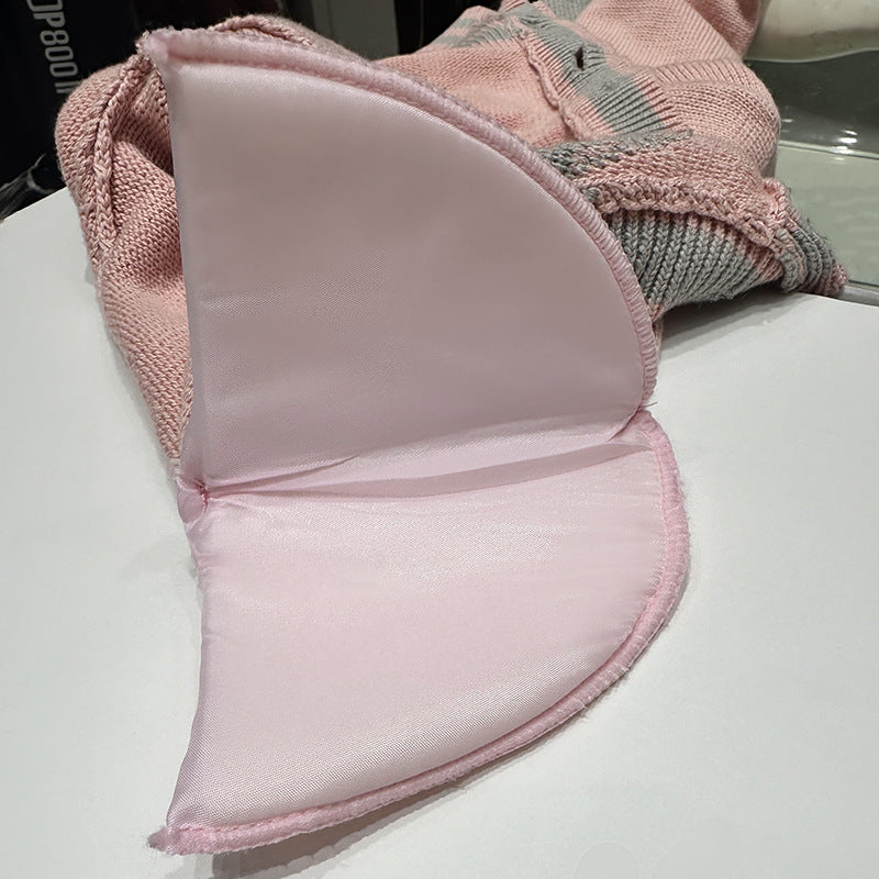 A chanel-style shoulder-padded knitted cardigan